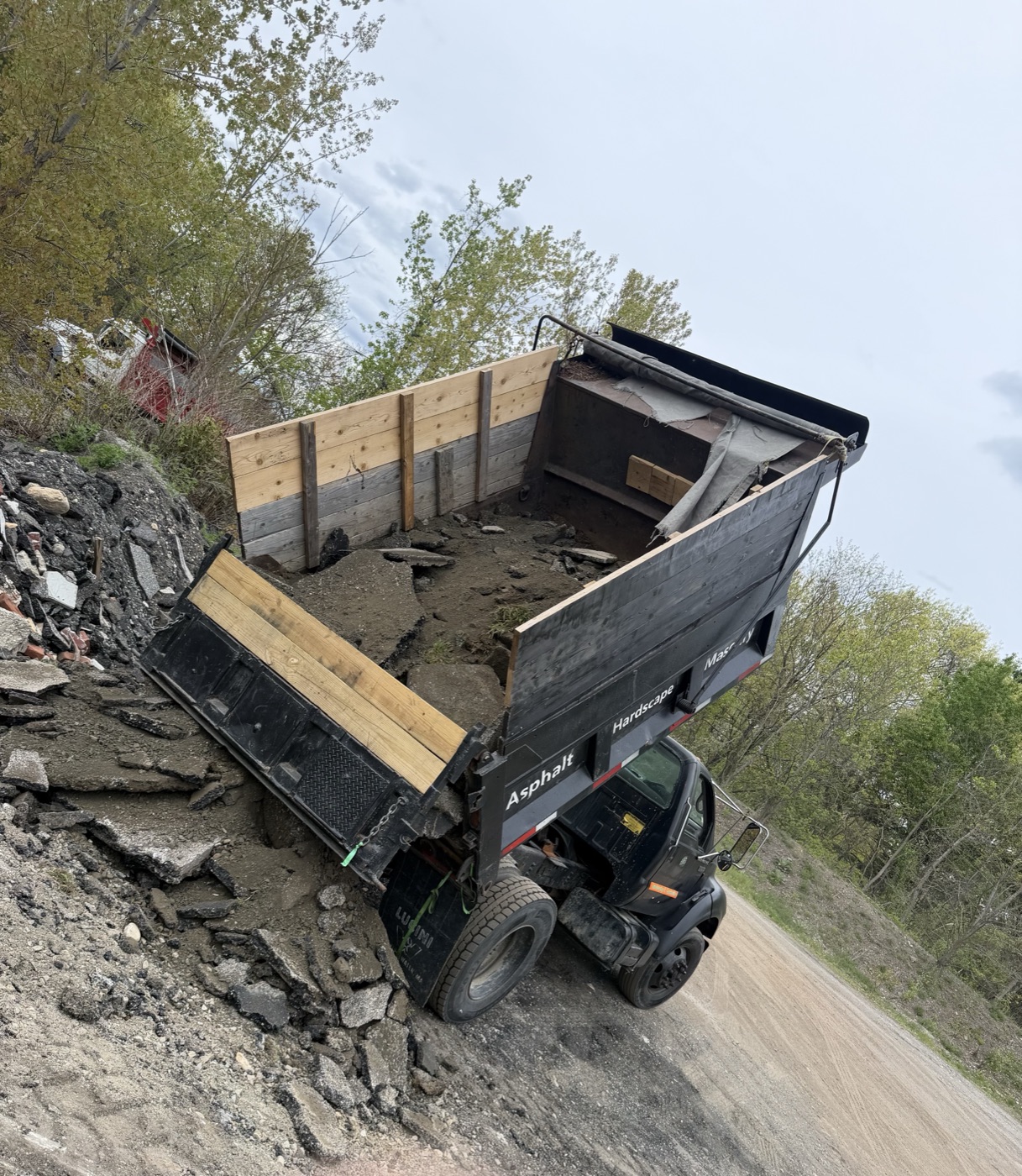 TB Lawn and Landscape dump truck on active excavation site in MetroWest MA